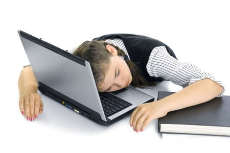The girl and the laptop. The girl was prepared for examinations and has fallen asleepの写真素材