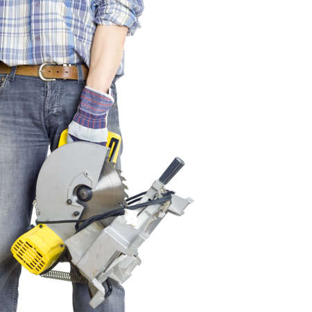 In a hand of the builder a ï¿½ircular saws. The isolated white background