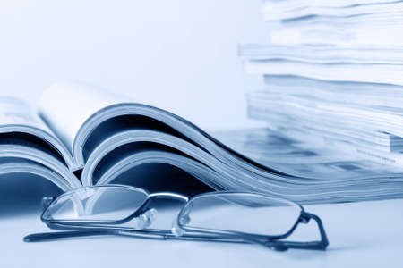 Open journals with glasses in frontの写真素材