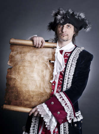 The captain with an old paper in handsの写真素材