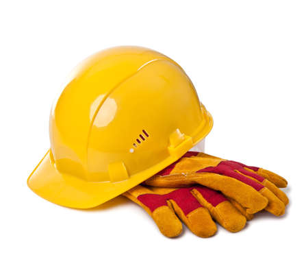 Building helmet and protective gloves on the isolated white background