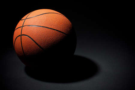 basketball ball on a black backgroundの写真素材