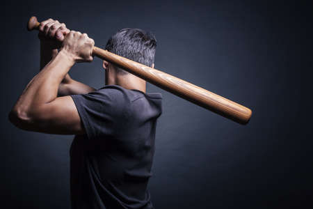 Man swung the bat. View from the backの写真素材