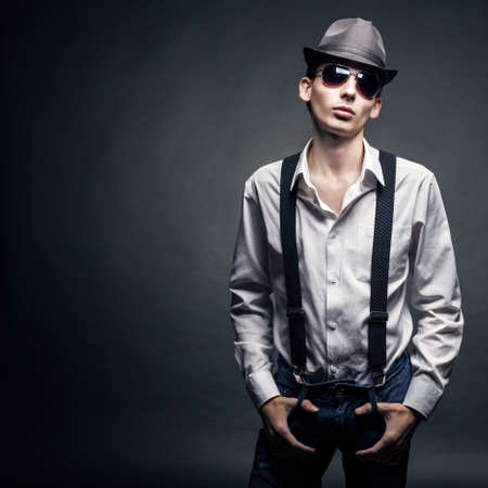Stylish young man on a black backgroundの写真素材