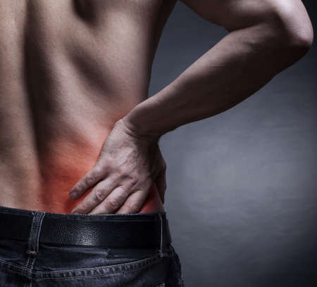 Backache. Pain in the lower back. Man's back