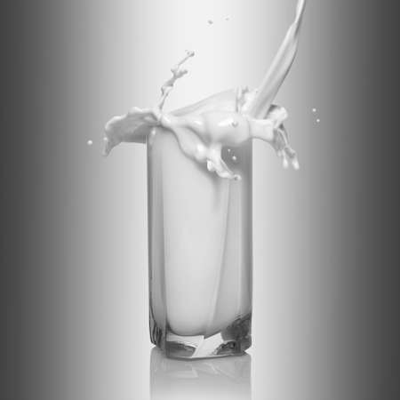 glass filled with milkの写真素材