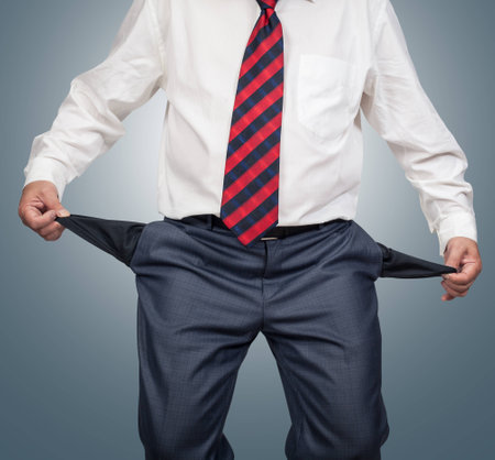 Businessman showing empty pockets