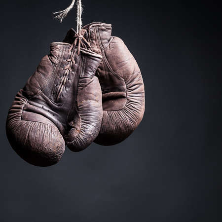 vintage boxing gloves on a  black backgroundの写真素材