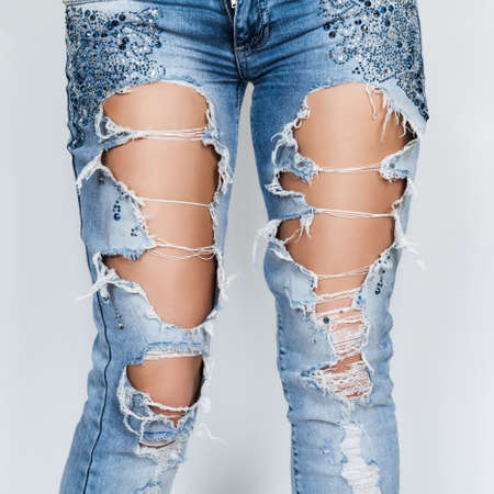 ripped jeans female feetの写真素材