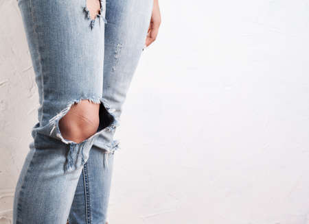 ripped jeans female feetの写真素材