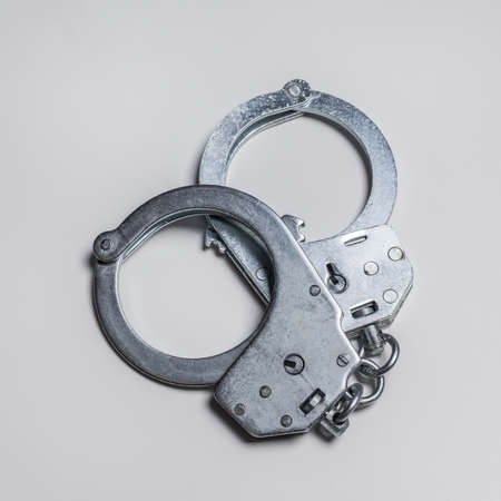 handcuffs on a white backgroundの写真素材