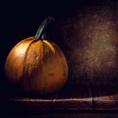 pumpkin on old wooden backgroundの写真素材