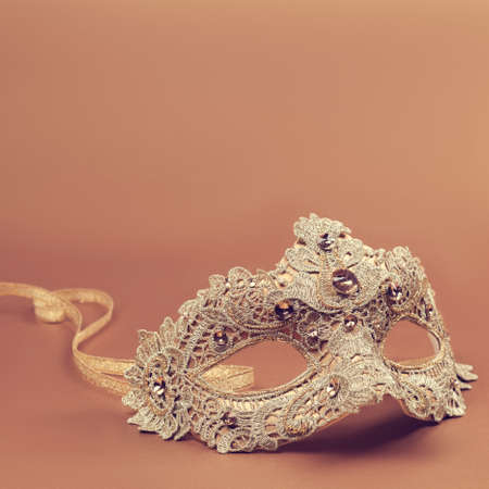 Carnival mask on an orange backgroundの写真素材