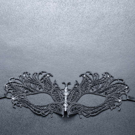 black carnival mask on a gray backgroundの写真素材