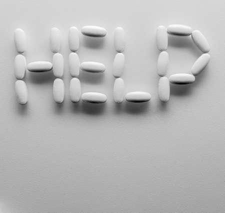 Help. Pills on white backgroundの写真素材