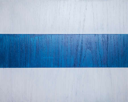 Wood texture. Applied to the surface acrylic white and blue paint stripesの写真素材