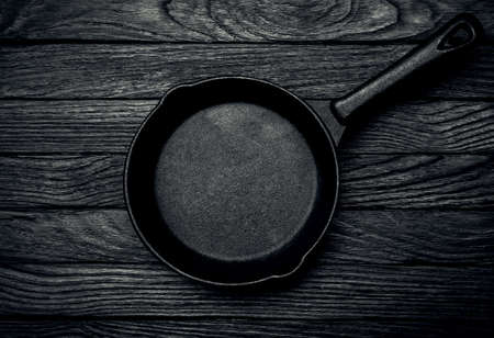 Frying pan on a woodenの写真素材