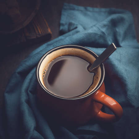Strong aromatic coffee in a red mugの写真素材