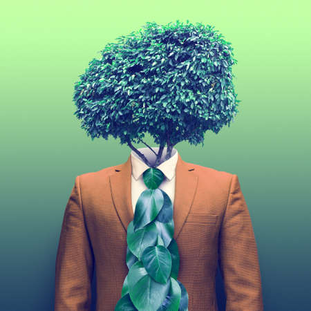 Surreal collage with mens jacket and green leaves.の写真素材
