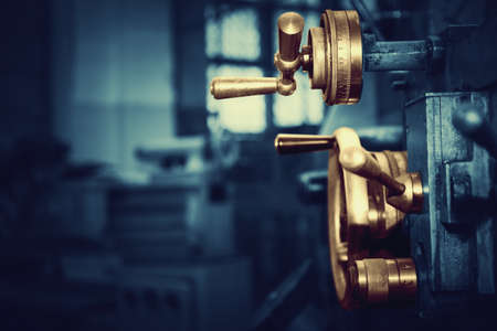 An old but still working lathe. Industrial background.の写真素材
