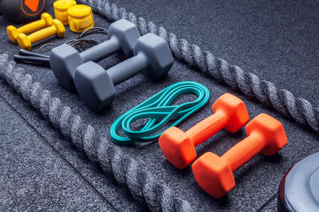 Sports equipment for training in the gym. Diagonal arrangement of objects in the picture.