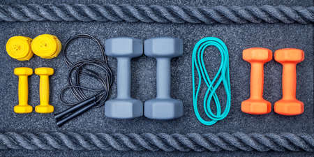 Sports equipment for training in the gym. View from above. Gray background.の写真素材