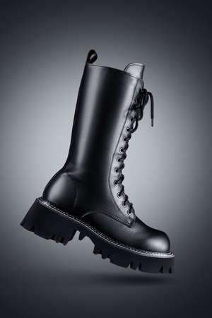 High women's laced boot on a gray background.の写真素材