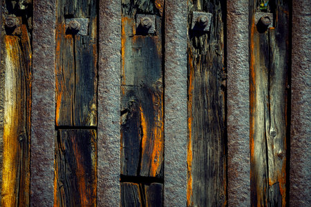 Old worn wooden background with rusty steel plates.の写真素材