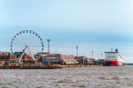 Panorama Of Katajanokka in Helsinki with Ferris wheel, port and cruise ferry, Finlandのeditorial素材