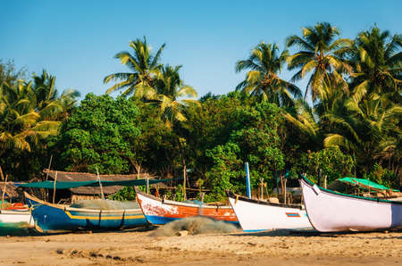 Wooden fishing boats on Morjim beach, North Goa Indiaの写真素材