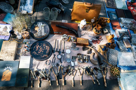 Tbilisi, Georgia - October 15, 2016: Flea market on Dry bridge having a lot of vintage, plates,...
