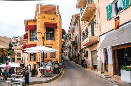 Port de Soller, Mallorca, Spain - May 26, 2016: Small colorful buildings with cozy outdoor...