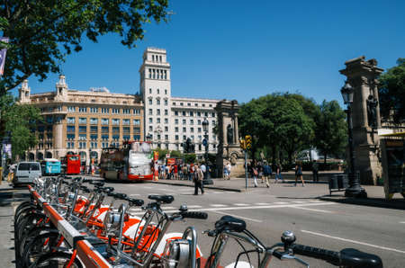 Barcelona, Spain - May 29, 2016: View of Catalonia Square with famous architecture. Rental bikes of the foreground. Ecologic transport of the big cityのeditorial素材