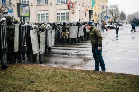 Minsk, Belarus - March 25, 2017 - Special police unit with shields against protesters. Belarusian people participate in the protest against the decree 3 Lukashenko and the current authorities.のeditorial素材