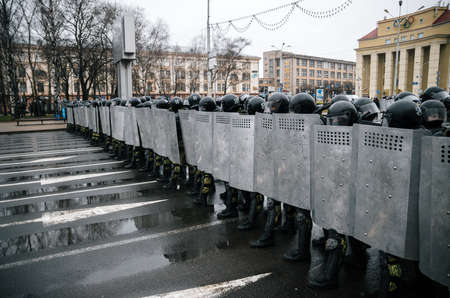 Minsk, Belarus - March 25, 2017 - Special police unit with shields against protesters. Belarusian people participate in the protest against the decree 3 Lukashenko and the current authorities.のeditorial素材