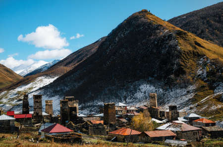 Svan Towers in Chazhashi village in Ushguli commune at the foot of the mountain with Tamar's Castle on top. Autumn. Caucasus, Upper Svaneti, Georgia. UNESCO World Heritage Site. Georgian landmarkの写真素材