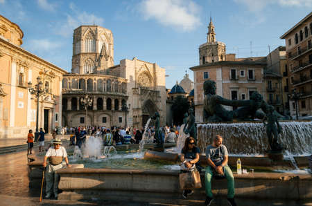 Valencia, Spain - June 3, 2017: Tourists and locals meet in the evening on Plaza de la Virgen Cathedral Square. Located in a central of Valencia.のeditorial素材