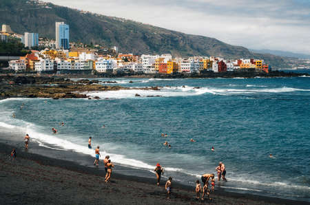 Puerto de la cruz, Tenerife, Canary islands, Spain - May 30, 2017: People sunbathing and relaxation in Playa Jardin. One of the best black sand beaches in Tenerifeのeditorial素材