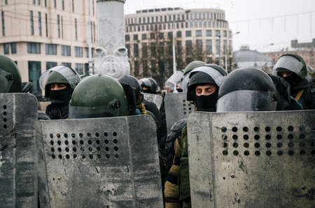 Minsk, Belarus - March 25, 2017 - Special police unit with shields against protesters. Belarusian people participate in the protest against the decree 3 Lukashenko and the current authorities.のeditorial素材
