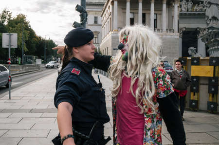 Vienna, Austria - October 1, 2017: People in costumes of mimes and clowns protest against Austrian ban on full-face veil in public placesのeditorial素材