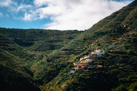 Small lonely mountain El turron Masca village with colorful in Tenerife, Canary Islands, Spain. Green slopes and hillsの写真素材