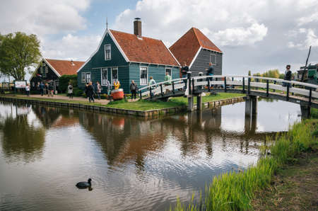 Zaanstad, Netherlands - 26 April, 2017: Authentic Zaandam mills and traditional vibrant houses on...