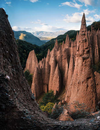 Earth pyramids with stones on top in Renon Ritten region, South Tyrol, Italy.の写真素材