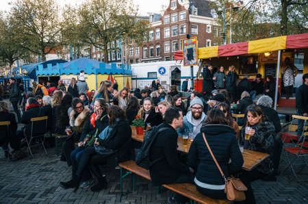 Amsterdam, Netherlands - April 25, 2017:People in outdoor cafe on crowded Nieuwmarkt New Market square in center of Amsterdam, Netherlands.のeditorial素材