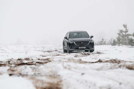 Minsk, Belarus - March 30, 2018: Exterior of second generation of Mazda CX-9 7-passenger SUV outdoor in forest roadのeditorial素材