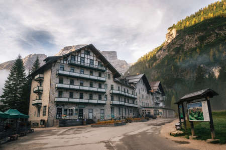 Braies, Italy - 4 October, 2017: Hotel nearby Braies Lake Lago di Braies or Pragser wildsee against mountain in dusk.Trentino Alto Adidge, Dolomites mountains, Italy.のeditorial素材