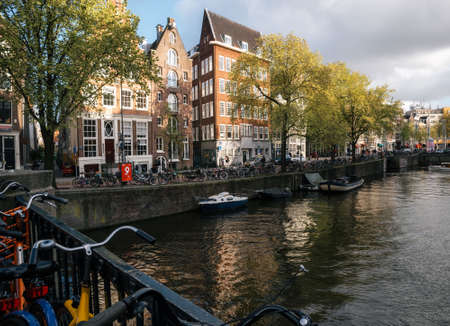Amsterdam, Netherlands - May 25, 2016: Outside view of Red Light District with bridge, bicycle and canalのeditorial素材