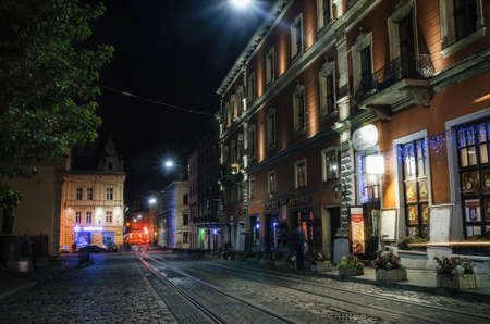 Lviv, Ukraine - September 22, 2016: Scenic view of illuminated street of Old Town at night, Lviv, Ukraine.のeditorial素材