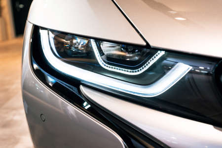 Munich, Germany - December 7, 2017: Headlight close-up of BMW i8 electric sports car