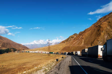 Stepantsminda, Georgia - October 10, 2016: Trucks line up in 20 km queue at Georgia-Russia border....